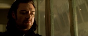 Movie still from “xXx” (2002), directed by Rob Cohen – A person with long black hair; Close Up shot, Low angle