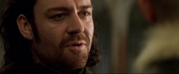 Movie still from “xXx” (2002), directed by Rob Cohen – A person with long hair; Close Up shot, Low angle