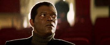 Movie still from “xXx” (2002), directed by Rob Cohen – A person wearing a sweater looking up; Close Up shot, Low angle