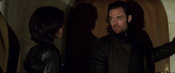 Movie still from “xXx” (2002), directed by Rob Cohen – A man and a woman standing next to each other in front of a mirror; Medium shot, Over the shoulder angle