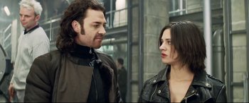 Movie still from “xXx” (2002), directed by Rob Cohen – A man and a woman standing next to each other; Close Up shot, Over the shoulder angle