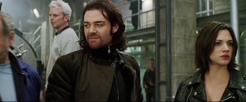 Movie still from “xXx” (2002), directed by Rob Cohen – A person with long hair; Close Up shot, Low angle