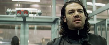 Movie still from “xXx” (2002), directed by Rob Cohen – A person with long hair; Close Up shot, Low angle