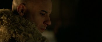 Movie still from “xXx” (2002), directed by Rob Cohen – A person wearing a coat; Close Up shot, Low angle