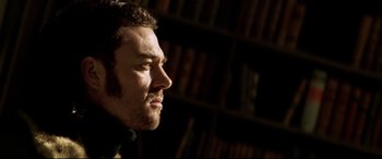 Movie still from “xXx” (2002), directed by Rob Cohen – A person looking to his left; Close Up shot, Low angle