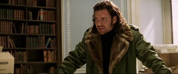 Movie still from “xXx” (2002), directed by Rob Cohen – A man in a green jacket and a fur collar; Close Up shot, Low angle