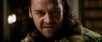 Movie still from “xXx” (2002), directed by Rob Cohen – A person with long hair; Close Up shot, Low angle