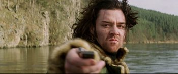 Movie still from “xXx” (2002), directed by Rob Cohen – A person holding a cell phone; Close Up shot, Low angle