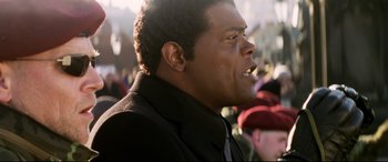 Movie still from “xXx” (2002), directed by Rob Cohen – A person wearing a suit and tie; Close Up shot, Low angle