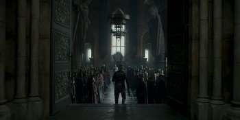 Movie still from “House of the Dragon” (2022), created by George R.R. Martin – A large group of people in a large room; Extreme Wide shot, High angle
