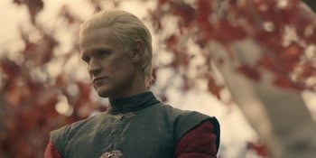 Movie still from “House of the Dragon” (2022), created by George R.R. Martin – A person with blond hair; Close Up shot, Low angle