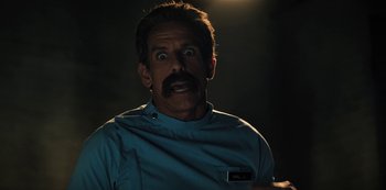 Movie still from “Hubie Halloween” (2020), directed by Steven Brill – A man in a blue shirt is looking surprised; Close Up shot, Over the shoulder angle