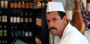 Movie still from “Hubie Halloween” (2020), directed by Steven Brill – A man in a chef's outfit with a mustache; Close Up shot, Over the shoulder angle