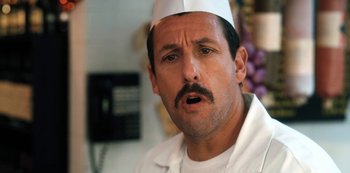 Movie still from “Hubie Halloween” (2020), directed by Steven Brill – A person wearing a hat; Close Up shot, Over the shoulder angle