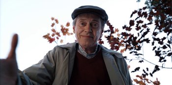 Movie still from “Hubie Halloween” (2020), directed by Steven Brill – An older man wearing a hat and a jacket; Close Up shot, Low angle