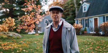 Movie still from “Hubie Halloween” (2020), directed by Steven Brill – An older man wearing a hat and a jacket; Medium shot, Over the shoulder angle