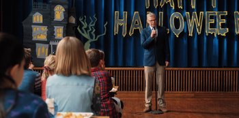 Movie still from “Hubie Halloween” (2020), directed by Steven Brill – Medium shot, Over the shoulder angle