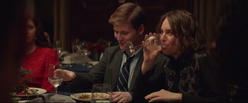 Movie still from “Human Capital” (2019), directed by Marc Meyers – A man and a woman sitting in front of a plate of food; Close Up shot, Over the shoulder angle