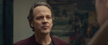 Movie still from “Human Capital” (2019), directed by Marc Meyers – A person wearing a jacket; Close Up shot, Over the shoulder angle