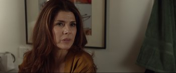 Movie still from “Human Capital” (2019), directed by Marc Meyers – A person sitting in a room; Close Up shot, Over the shoulder angle