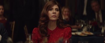 Movie still from “Human Capital” (2019), directed by Marc Meyers – A person wearing a red dress; Close Up shot, Over the shoulder angle