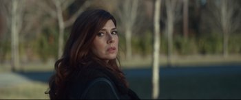 Movie still from “Human Capital” (2019), directed by Marc Meyers – A person with long hair; Close Up shot, Over the shoulder angle