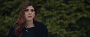Movie still from “Human Capital” (2019), directed by Marc Meyers – A person wearing a black jacket; Close Up shot, High angle