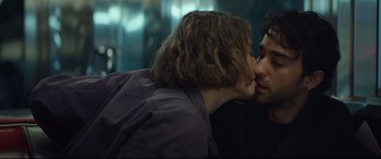 Movie still from “Human Capital” (2019), directed by Marc Meyers – A man and a woman kissing each other; Close Up shot, Over the shoulder angle