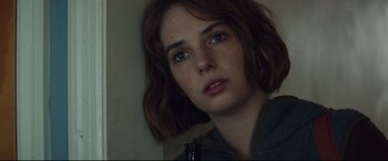 Movie still from “Human Capital” (2019), directed by Marc Meyers – A person holding a beer bottle; Close Up shot, Low angle