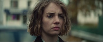 Movie still from “Human Capital” (2019), directed by Marc Meyers – A person with short hair; Close Up shot, Over the shoulder angle