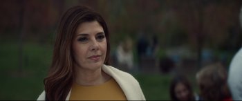 Movie still from “Human Capital” (2019), directed by Marc Meyers – A person wearing a yellow shirt; Close Up shot, Over the shoulder angle