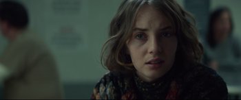 Movie still from “Human Capital” (2019), directed by Marc Meyers – A person wearing a sweater; Close Up shot, Over the shoulder angle