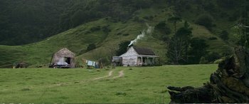 Movie still from “Hunt for the Wilderpeople” (2016), directed by Taika Waititi – An old house in the middle of a green field; Extreme Wide shot, Low angle