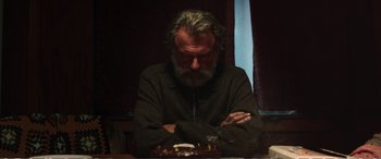 Movie still from “Hunt for the Wilderpeople” (2016), directed by Taika Waititi – An older man sitting in front of a birthday cake; Close Up shot, Low angle