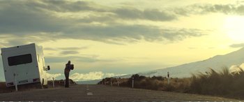 Movie still from “Hunt for the Wilderpeople” (2016), directed by Taika Waititi – A road with a lot of signs on the side of the road; Extreme Wide shot, Low angle