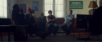 Movie still from “Hunt for the Wilderpeople” (2016), directed by Taika Waititi – A group of people sitting in a room; Wide shot, Low angle