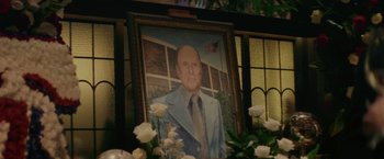 Movie still from “Hustle” (2022), directed by Jeremiah Zagar – A portrait of a man in a suit and tie; Extreme Close Up shot, Low angle