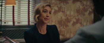 Movie still from “Hustle” (2022), directed by Jeremiah Zagar – A person sitting in a room; Close Up shot, Over the shoulder angle