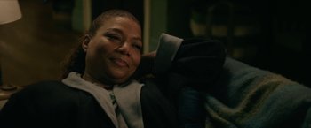 Movie still from “Hustle” (2022), directed by Jeremiah Zagar – A person sitting on a chair; Close Up shot, Over the shoulder angle