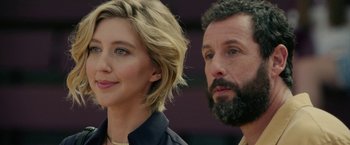 Movie still from “Hustle” (2022), directed by Jeremiah Zagar – A man and a woman standing next to each other; Close Up shot, Over the shoulder angle