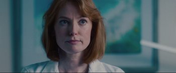 Movie still from “I Care a Lot” (2020), directed by J Blakeson – A person wearing a white shirt; Close Up shot, Low angle