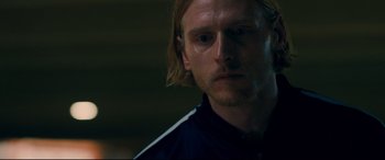 Movie still from “I Care a Lot” (2020), directed by J Blakeson – A person with long blonde hair; Close Up shot, Over the shoulder angle