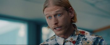 Movie still from “I Care a Lot” (2020), directed by J Blakeson – A person with long blonde hair; Close Up shot, Over the shoulder angle