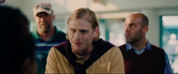 Movie still from “I Care a Lot” (2020), directed by J Blakeson – A person with long blonde hair; Close Up shot, Over the shoulder angle