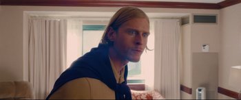 Movie still from “I Care a Lot” (2020), directed by J Blakeson – A person with long blonde hair; Close Up shot, Over the shoulder angle