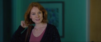 Movie still from “I Care a Lot” (2020), directed by J Blakeson – A person wearing a jacket; Close Up shot, Over the shoulder angle