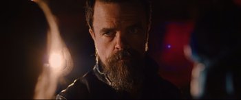 Movie still from “I Care a Lot” (2020), directed by J Blakeson – A person with a beard; Close Up shot, Low angle