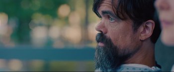 Movie still from “I Care a Lot” (2020), directed by J Blakeson – A person with a beard; Close Up shot, Over the shoulder angle