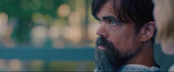 Movie still from “I Care a Lot” (2020), directed by J Blakeson – A person with a beard; Close Up shot, Over the shoulder angle