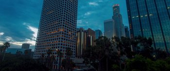Movie still from “I Care a Lot” (2020), directed by J Blakeson – A view of a city skyline at night; Extreme Wide shot, High angle